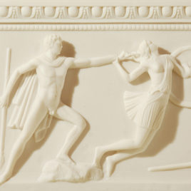 a statue depicting a man and a warrior Amazons