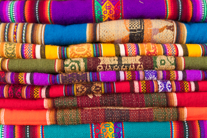 closeup image on classic colorful peruvian fabric background